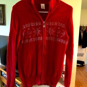 Red zipper front sweater with snowflake accents